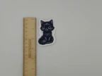 Cute Black Kitten With Big Purple Eyes Sticker